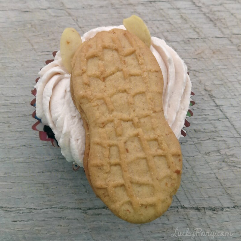 Use cashews and nutter butters to create a horse to decorate your cupcake