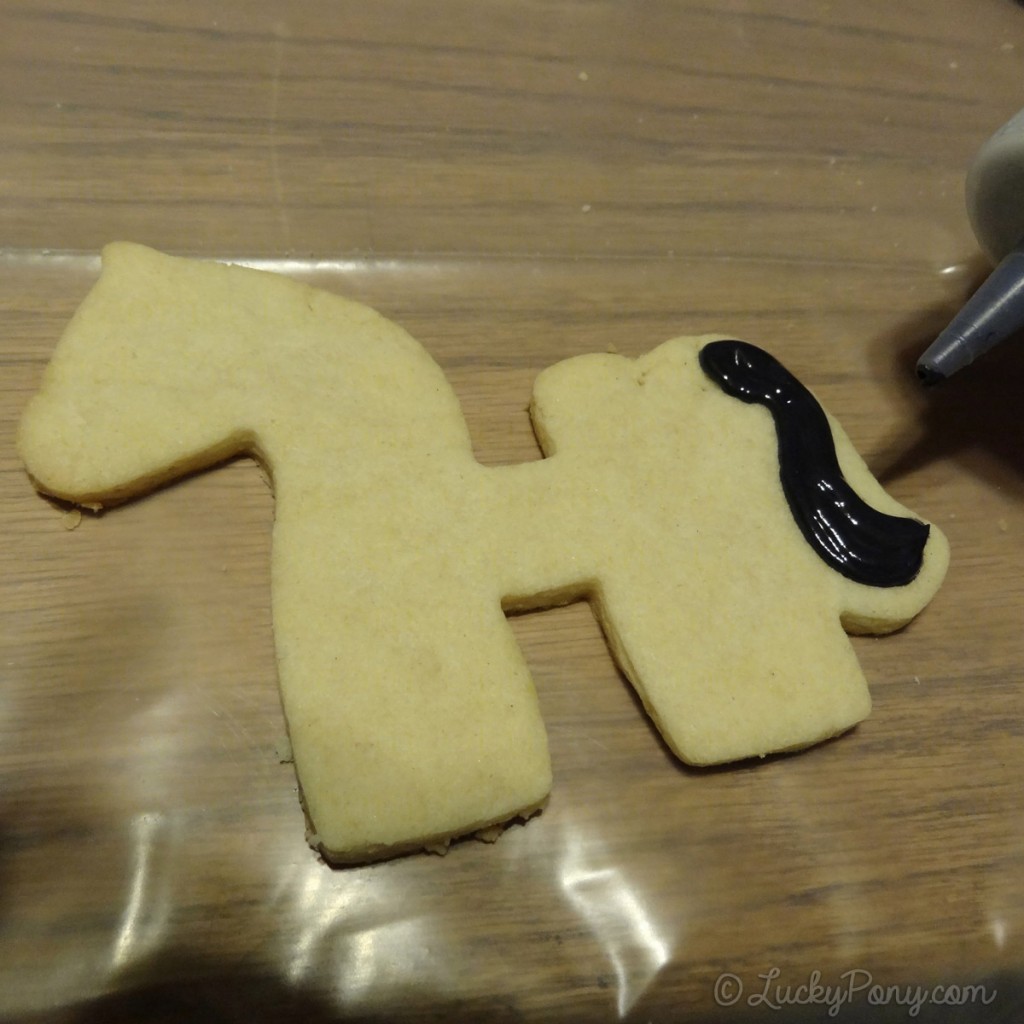decorating a horse cookie