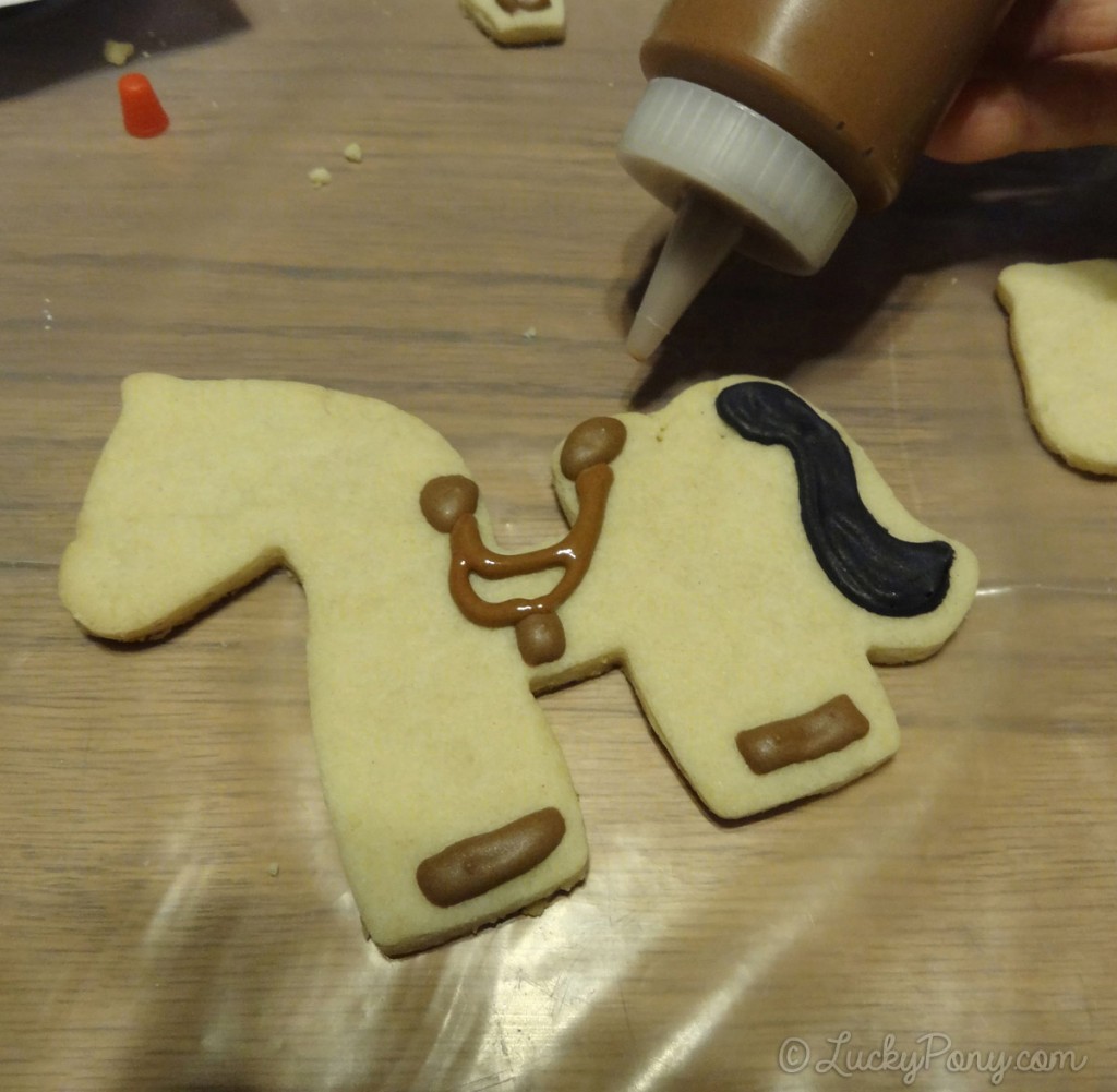 decorating a horse cookie