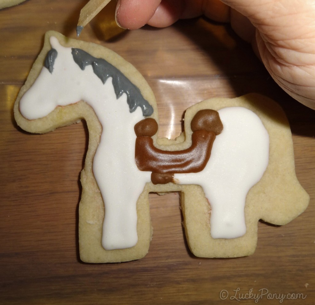 decorating a horse cookie